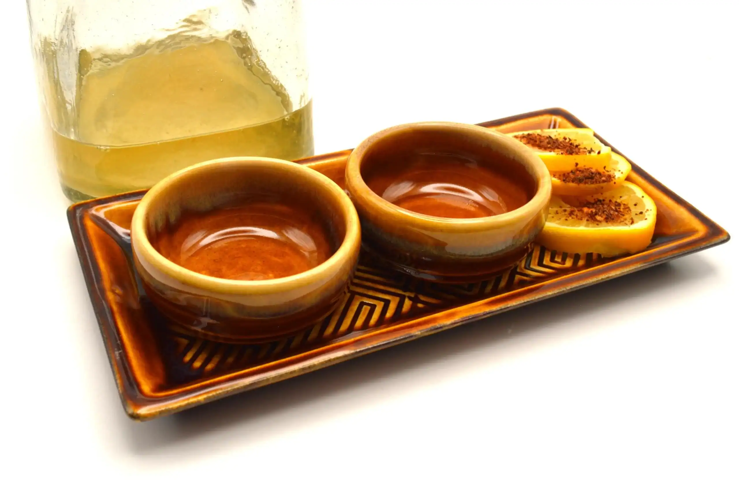 mezcal copitas on tray with lemon